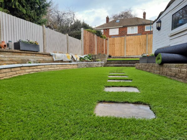 Supreme lawn 45mm luxury lawn installed with stepping stones garden path